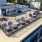 aerial view of rooftop terrace with grills and lounge chairs