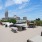 rooftop deck with lounge chairs and grilling area