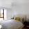 sunlit bedroom with ceiling fan